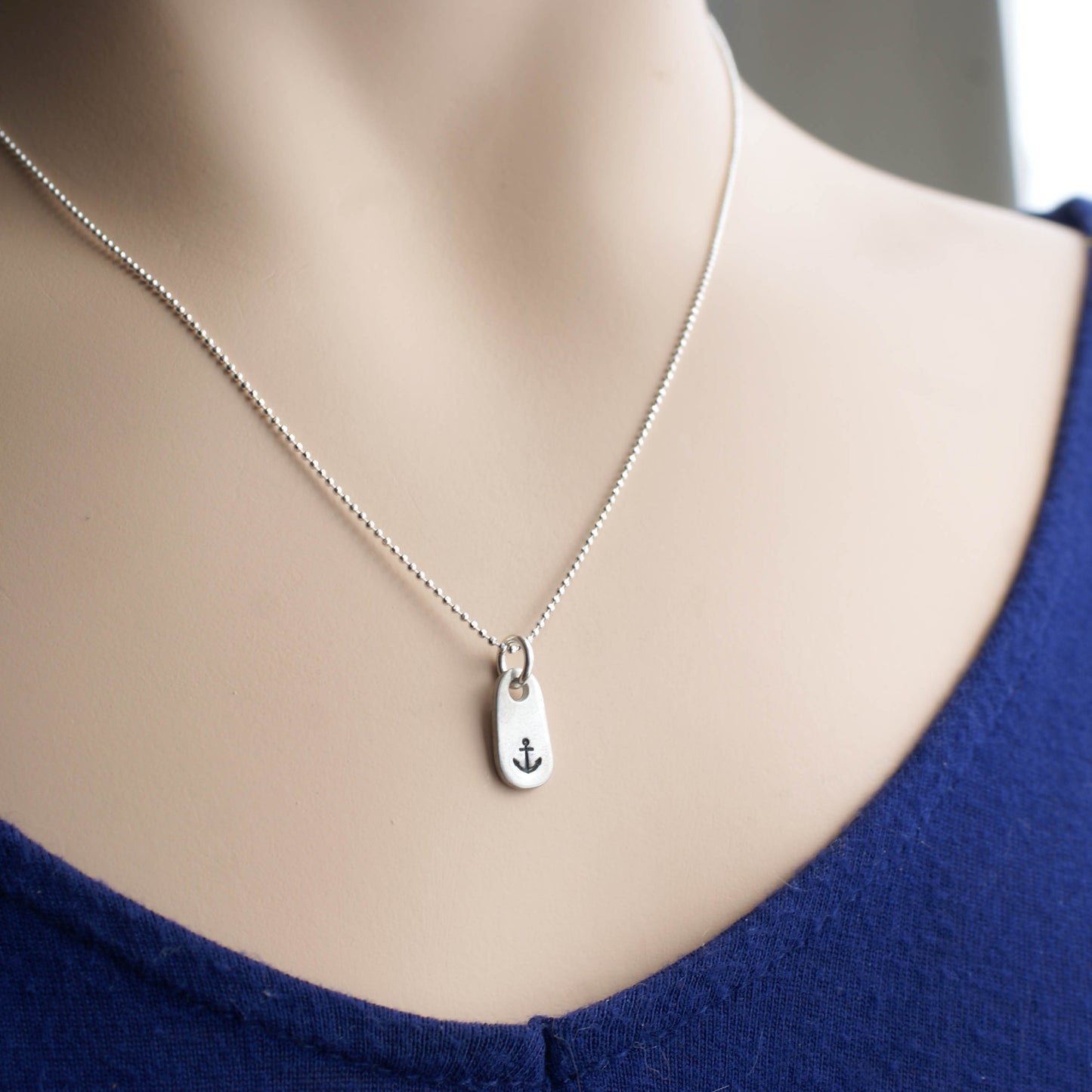 Dainty Handstamped Anchor Necklace in Pewter on woman