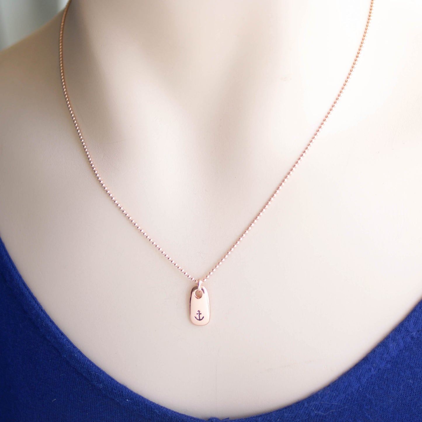 Refuse to Sink Anchor Necklace in Rose Gold on neck