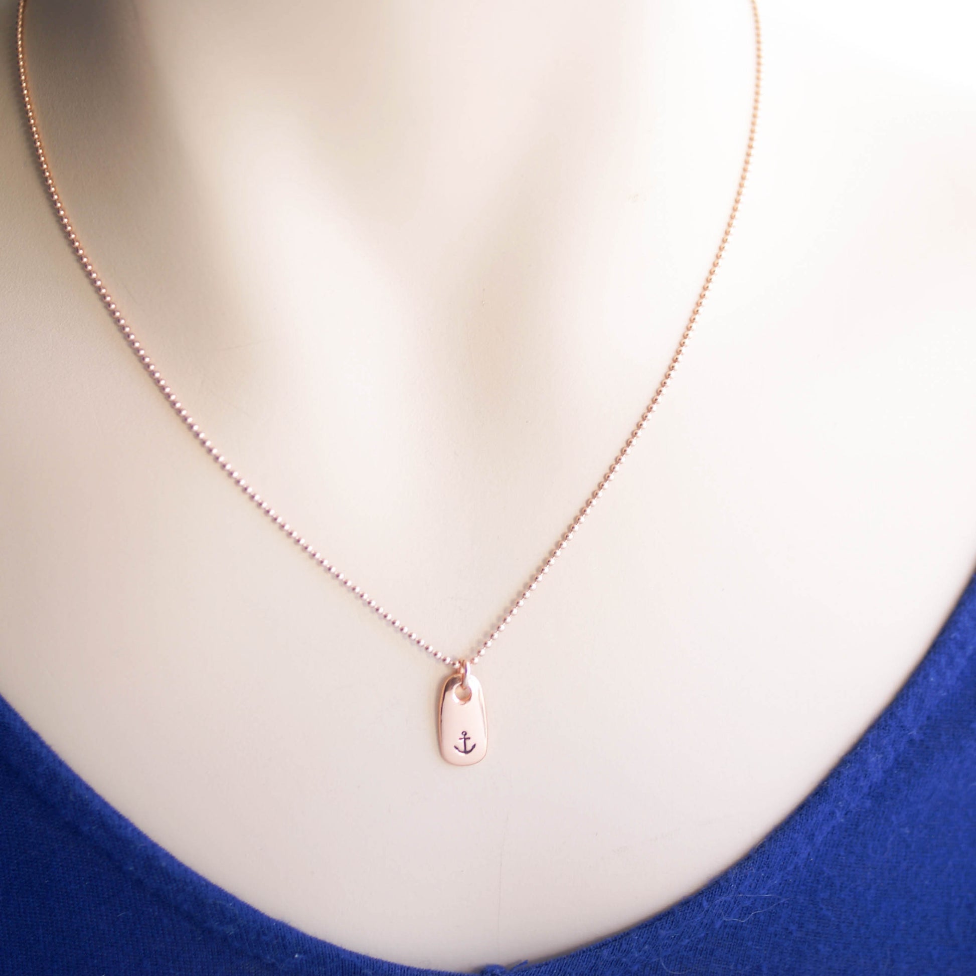 Refuse to Sink Anchor Necklace in Rose Gold on neck