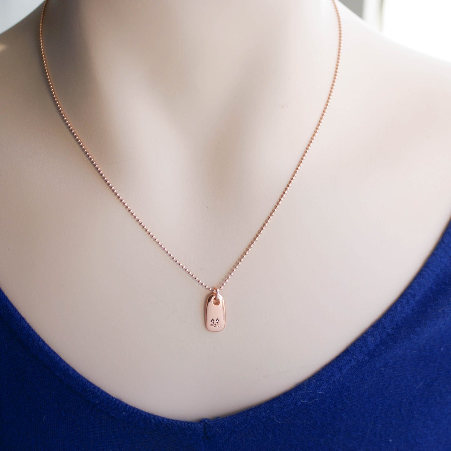 Petite Rose Gold Necklace handstamped with a kitty face on neck