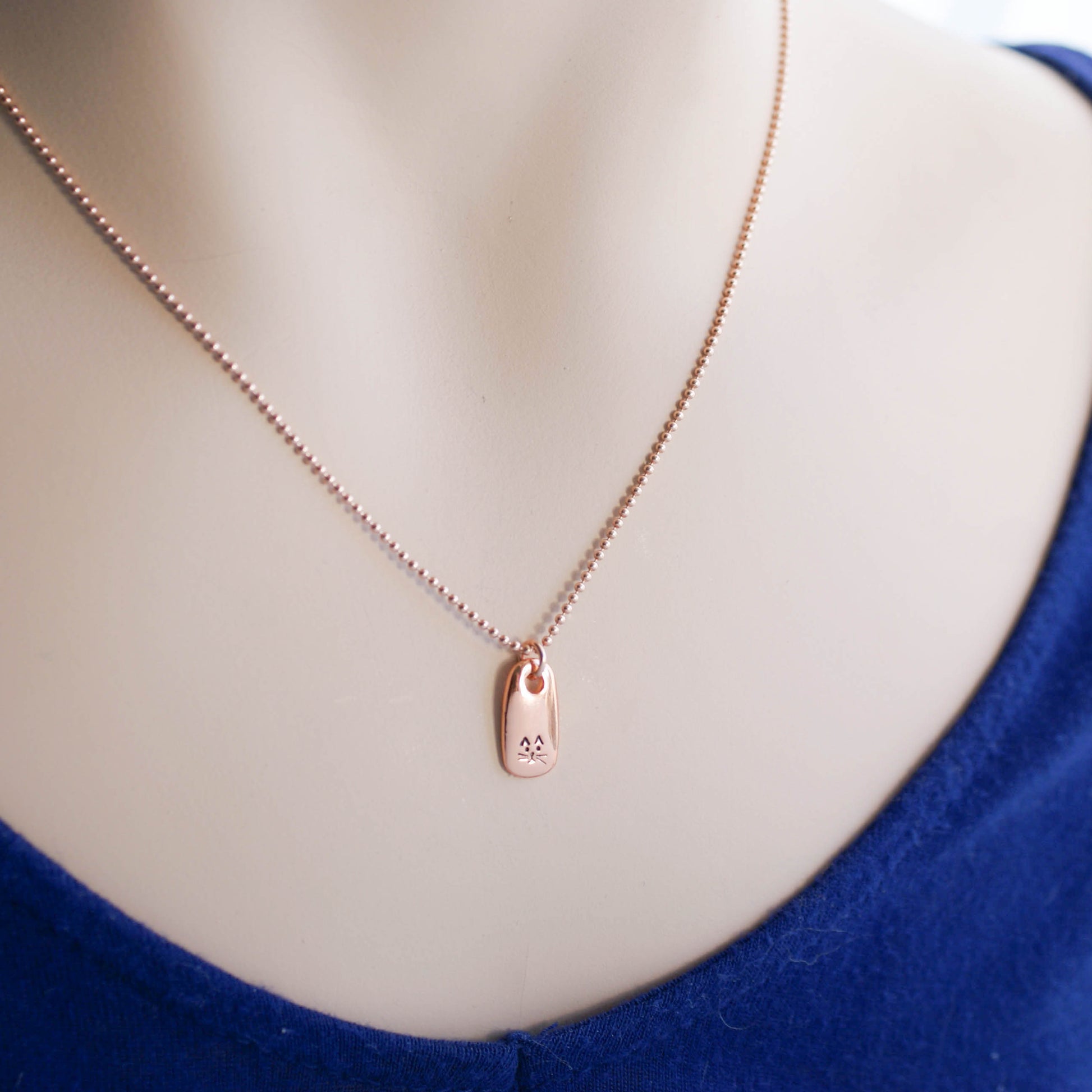 Petite Rose Gold Necklace handstamped with a kitty face on neck