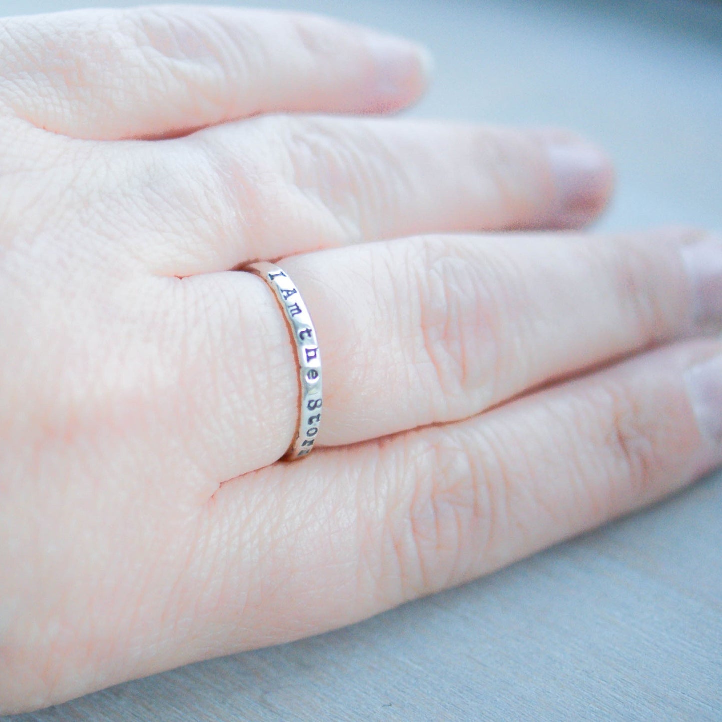Image of I am the storm minimalist ring on hand