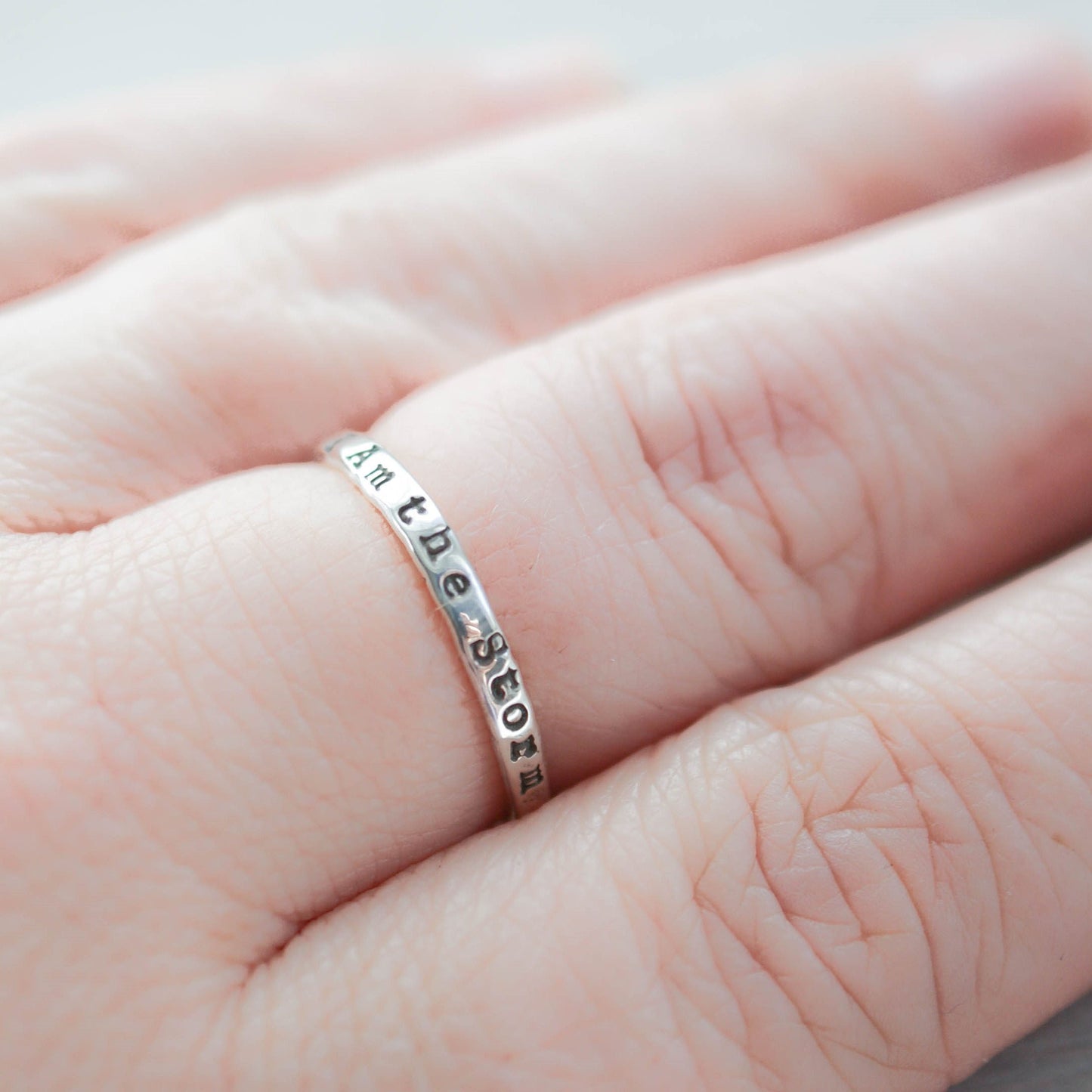 Image of I am the storm stackable ring on hand