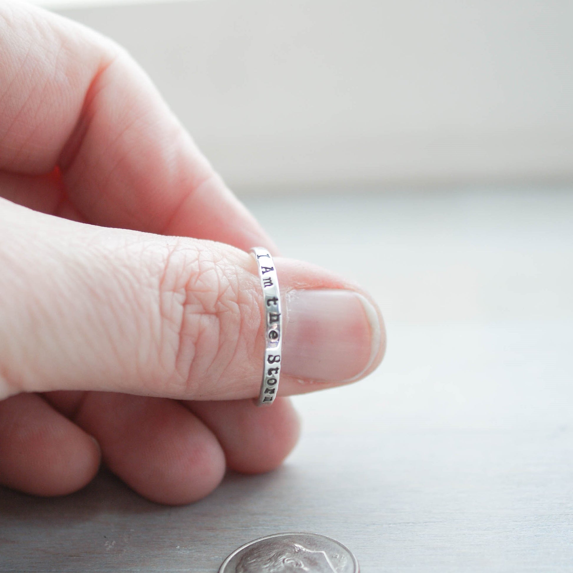 Image of I am the storm stacking ring on thumb