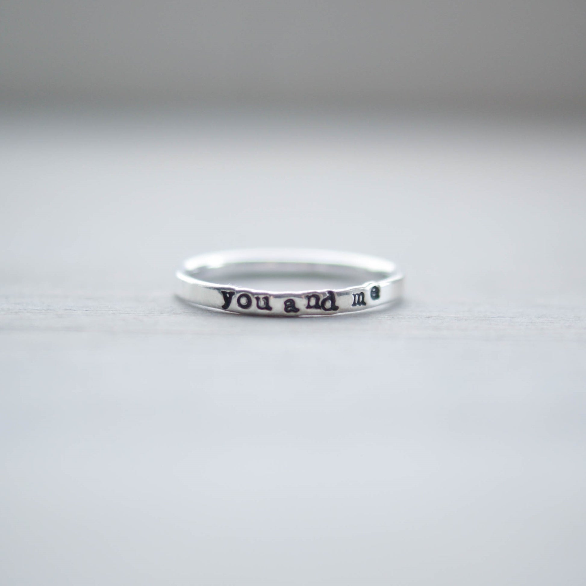 Skinny sterling silver ring stamped with you and me