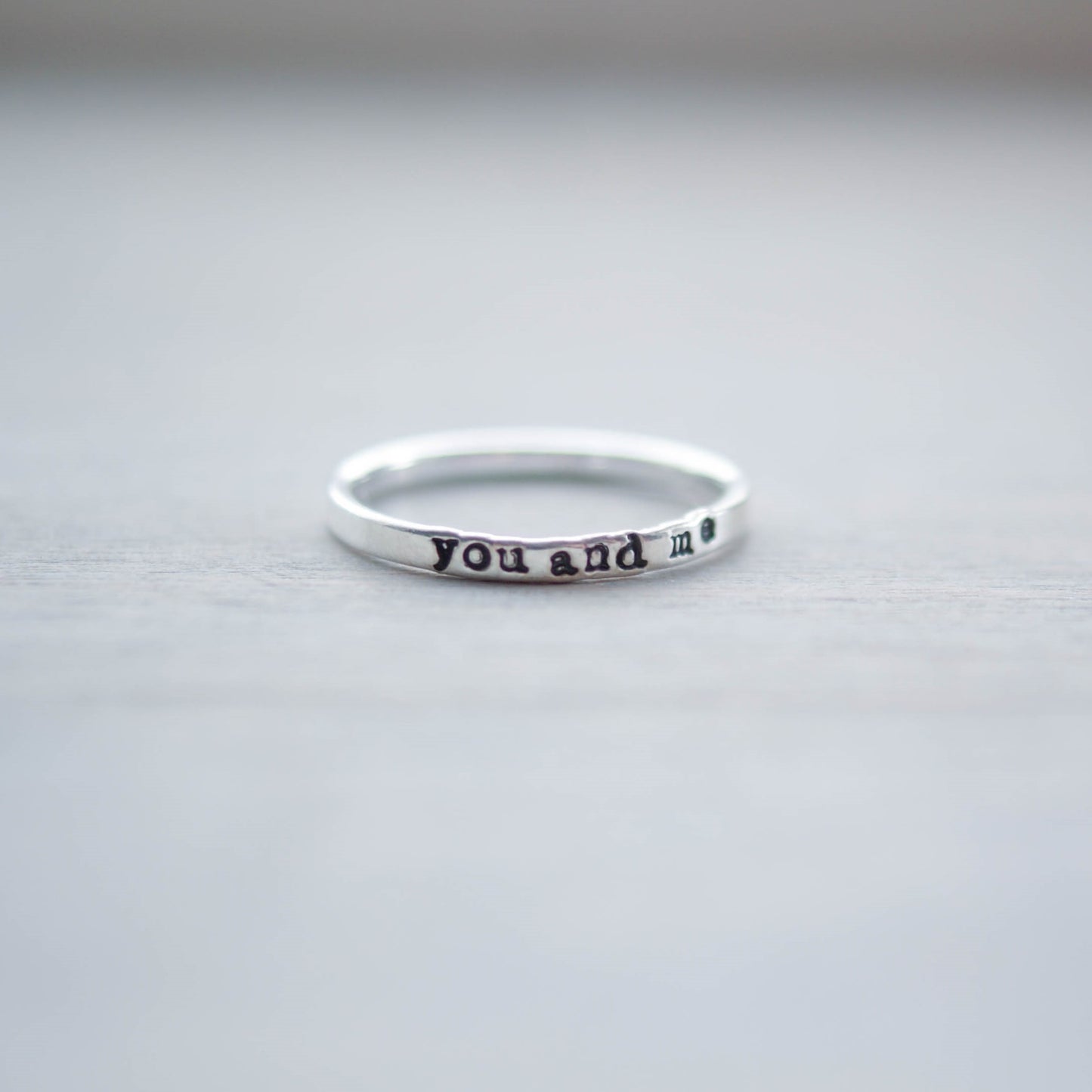 Skinny sterling silver ring stamped with you and me