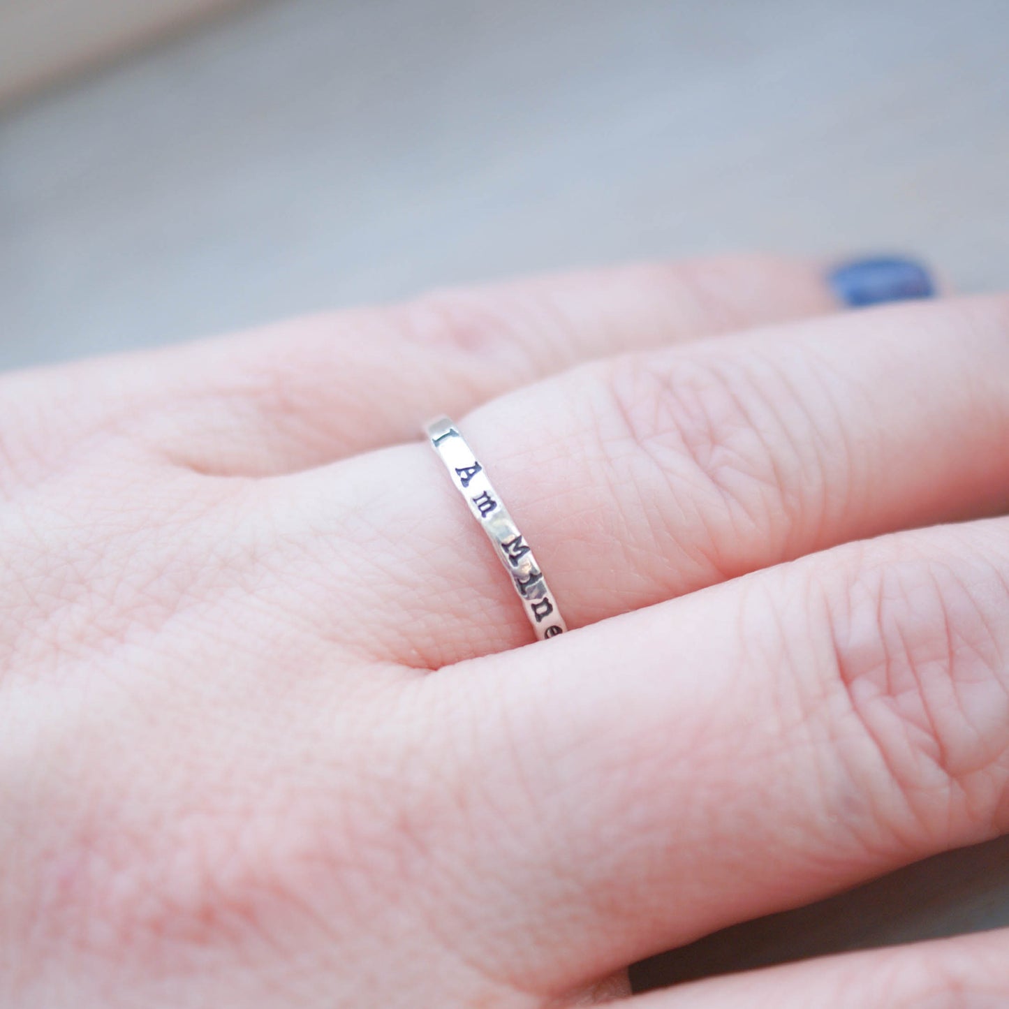Sterling Silver Stacking Ring handstamped with I Am Mine on hand