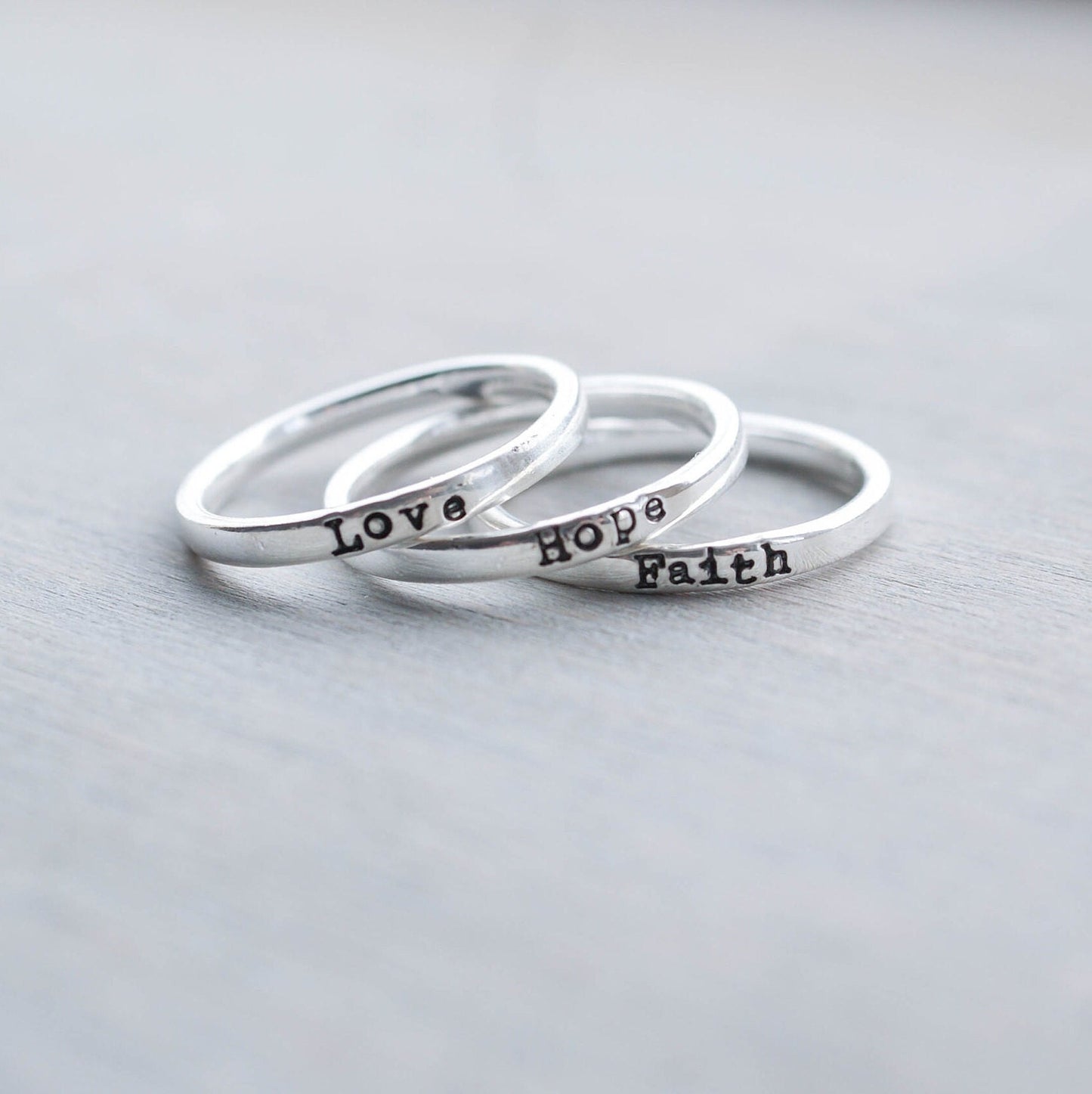 3 Sterling silver rings stamped with Faith, hope and love