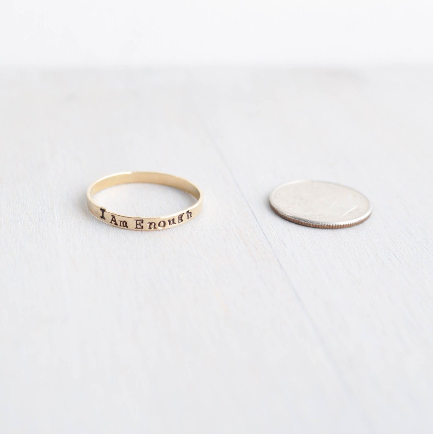 I am Enough ring handstamped in gold-filled next to dime