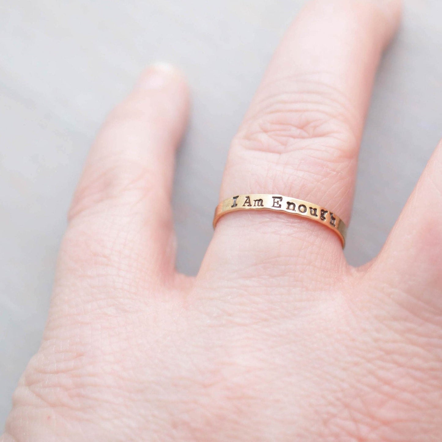 I am Enough ring handstamped in gold-filled on hand