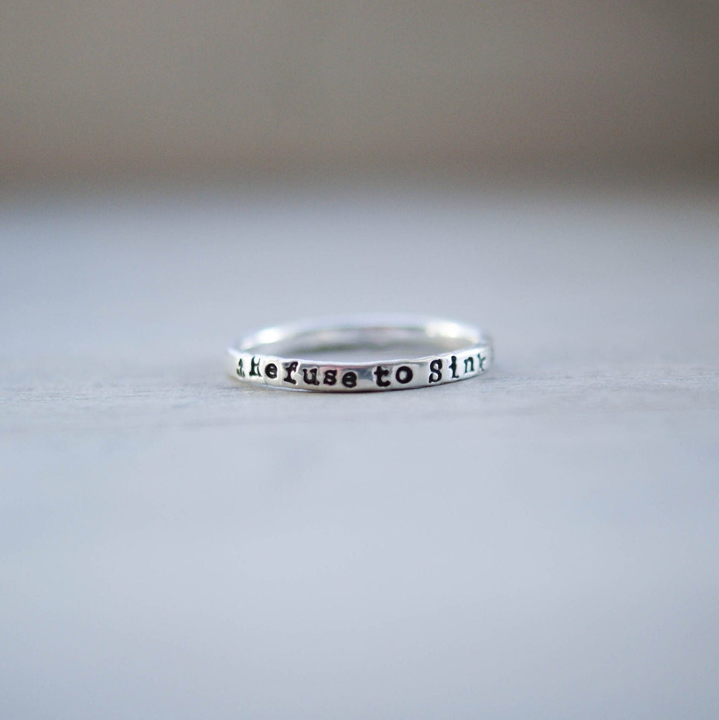 Sterling silver ring handstamped with Refuse to sink