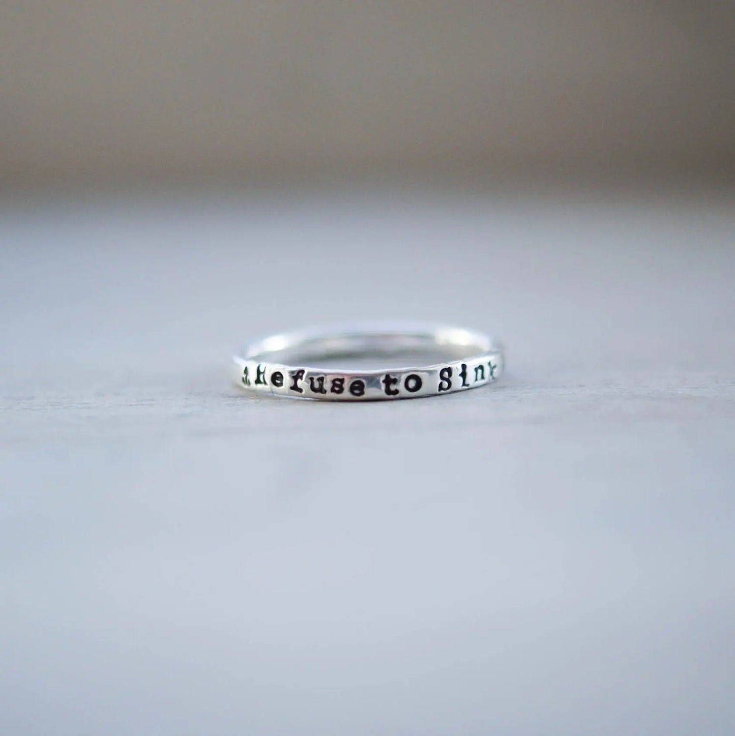 Sterling silver ring handstamped with Refuse to sink