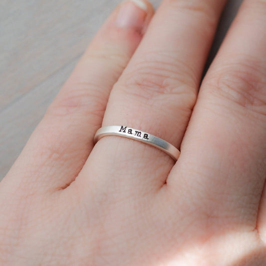Sterling silver ring handstamped with Mama on hand