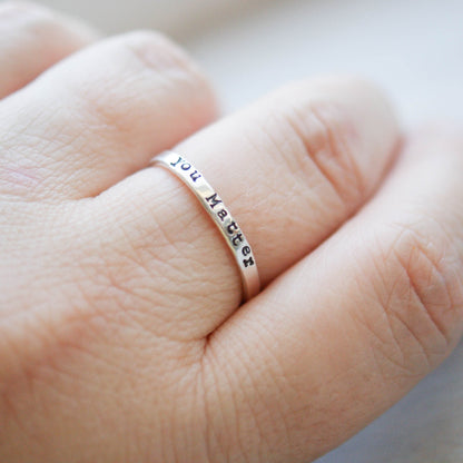 Sterling silver ring stamped with you matter on hand