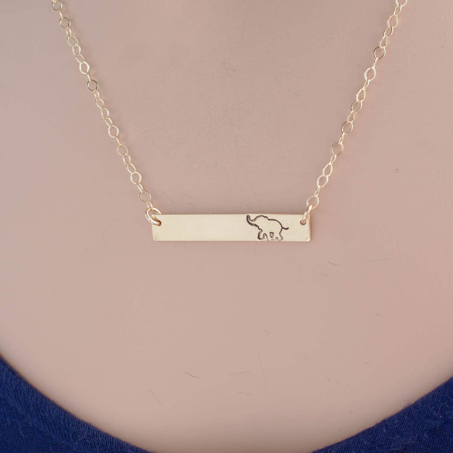 Gold bar neckalce stamped with elephant on necklace