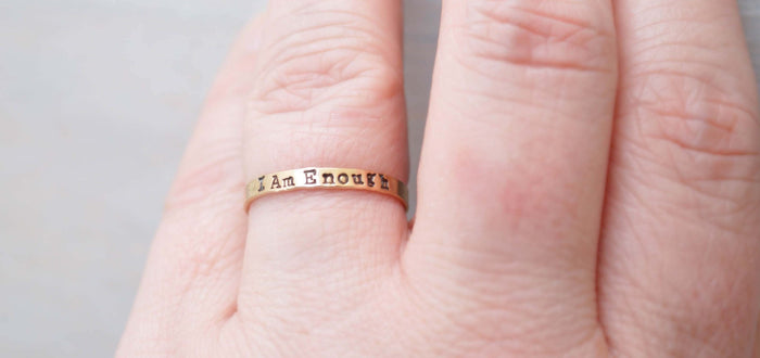 image of i am enough ring in gold filled on a hand