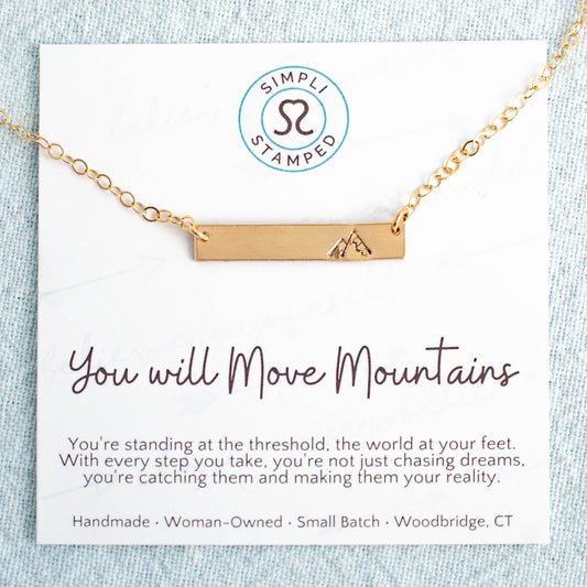 image of gold filled necklace stamped with a mountain on a card with  you will move mountains and a motivational  quote