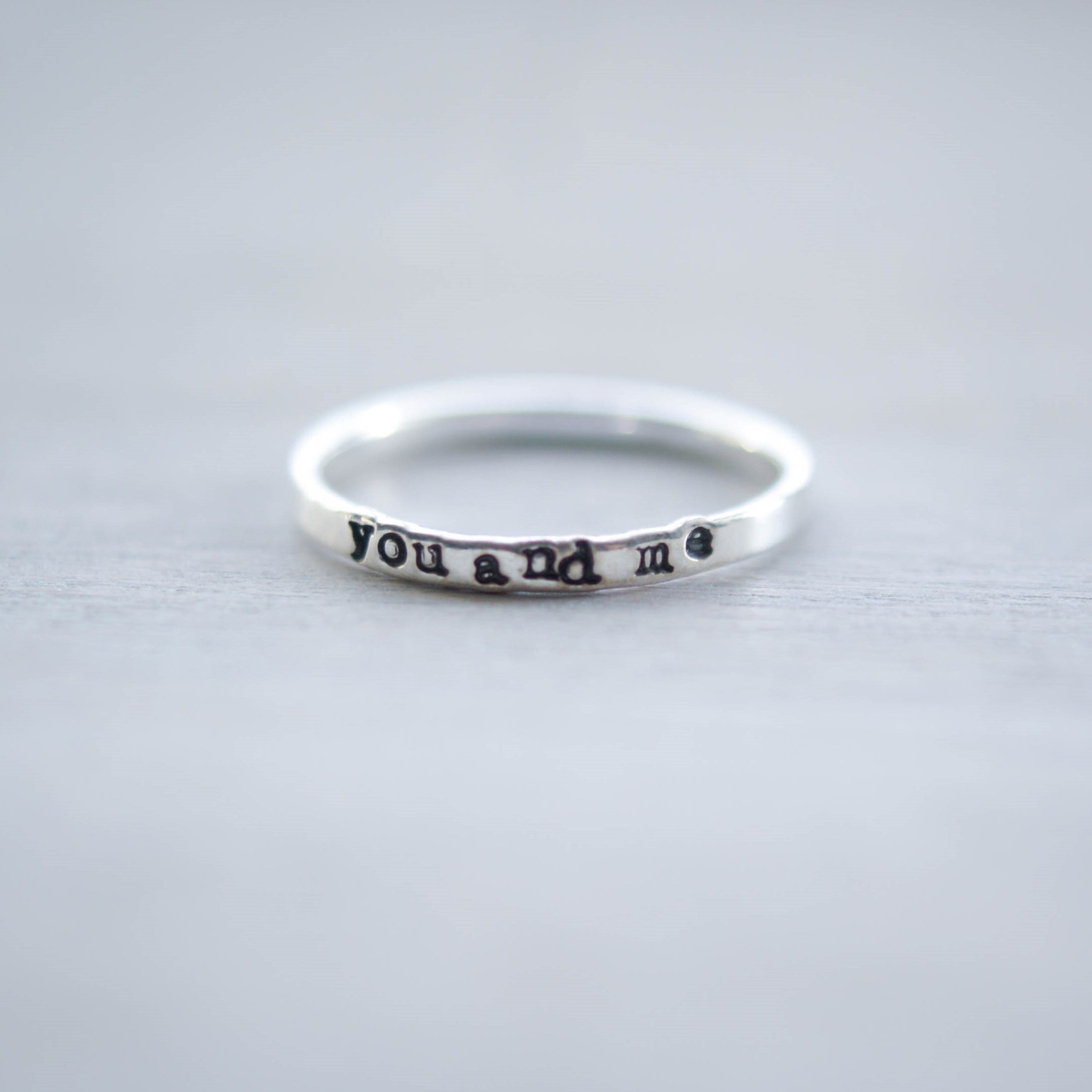 Skinny sterling silver ring stamped with you and me