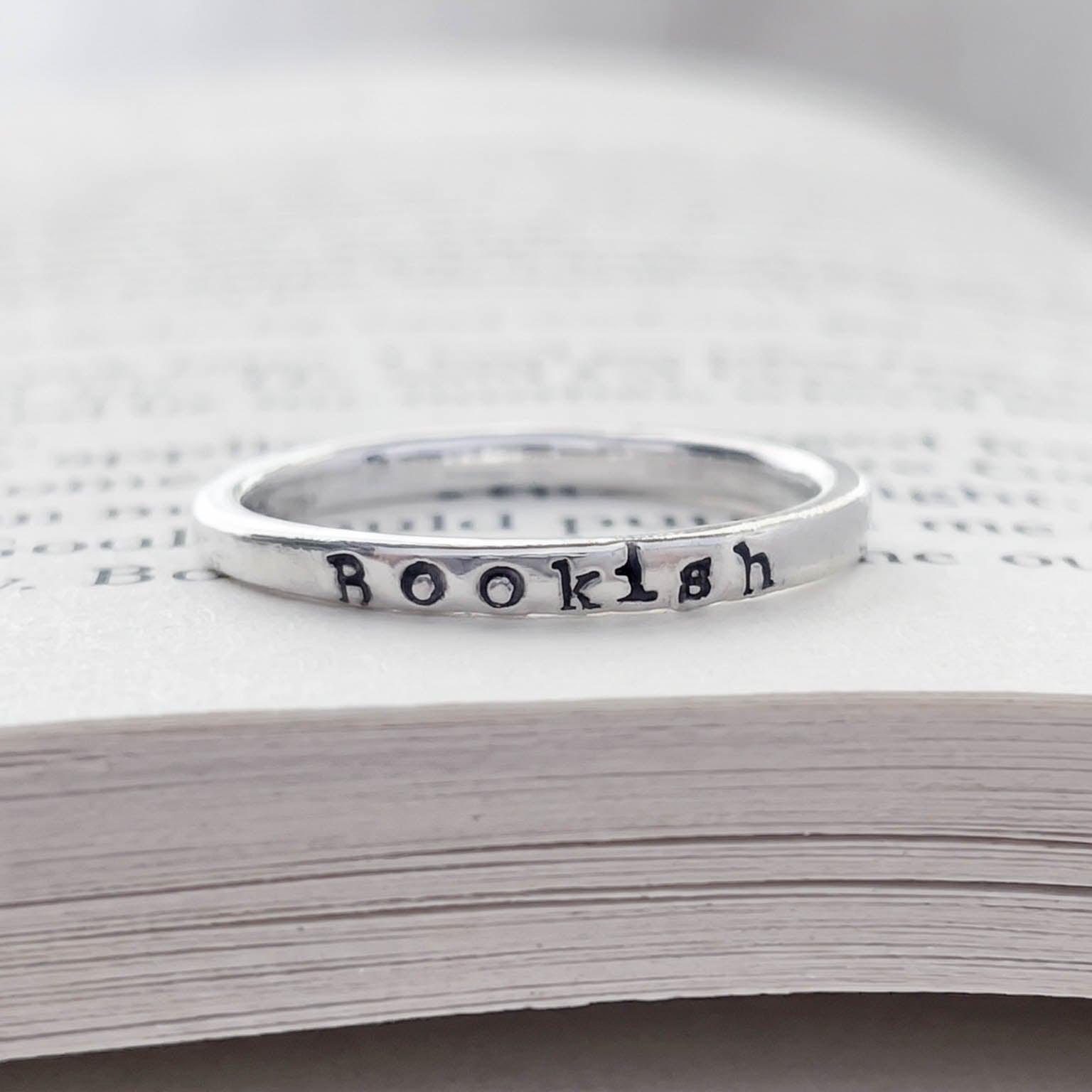 sterling silver ring inscribed with Bookish on a book