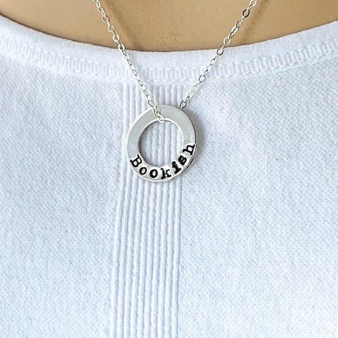 sterling silver neckalce stamped with Bookish on white background