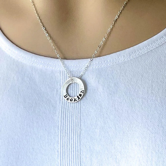 sterling silver neckalce stamped with Bookish on white background