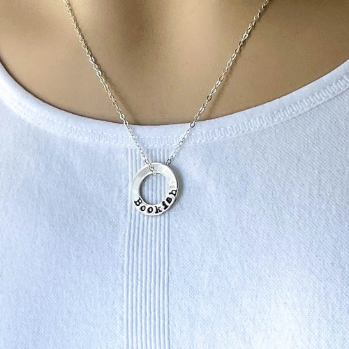 sterling silver neckalce stamped with Bookish on white background