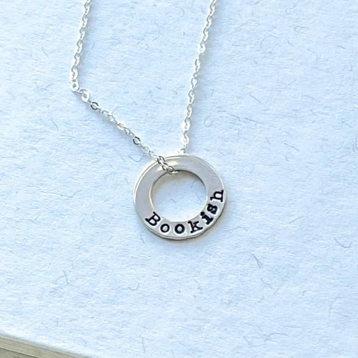 sterling silver neckalce stamped with Bookish on white background