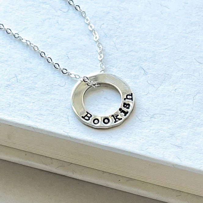 sterling silver neckalce stamped with Bookish on white background
