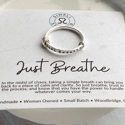 image of sterling silver ring stamped with Just Breathe on an inspirational card