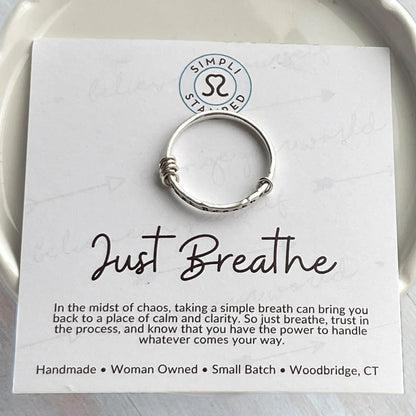 image of sterling silver ring stamped with Just Breathe on an inspirational card
