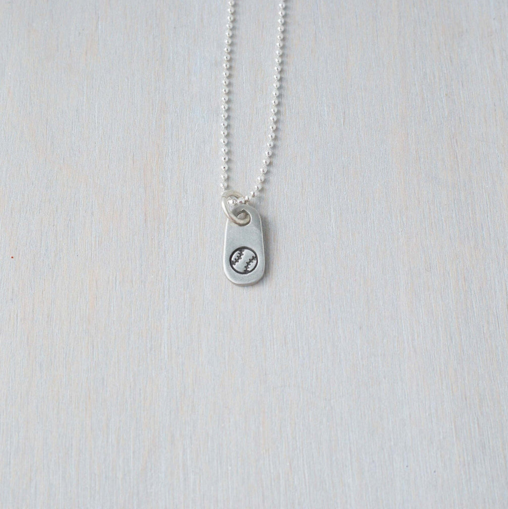Silver softball necklace in artisan pewter