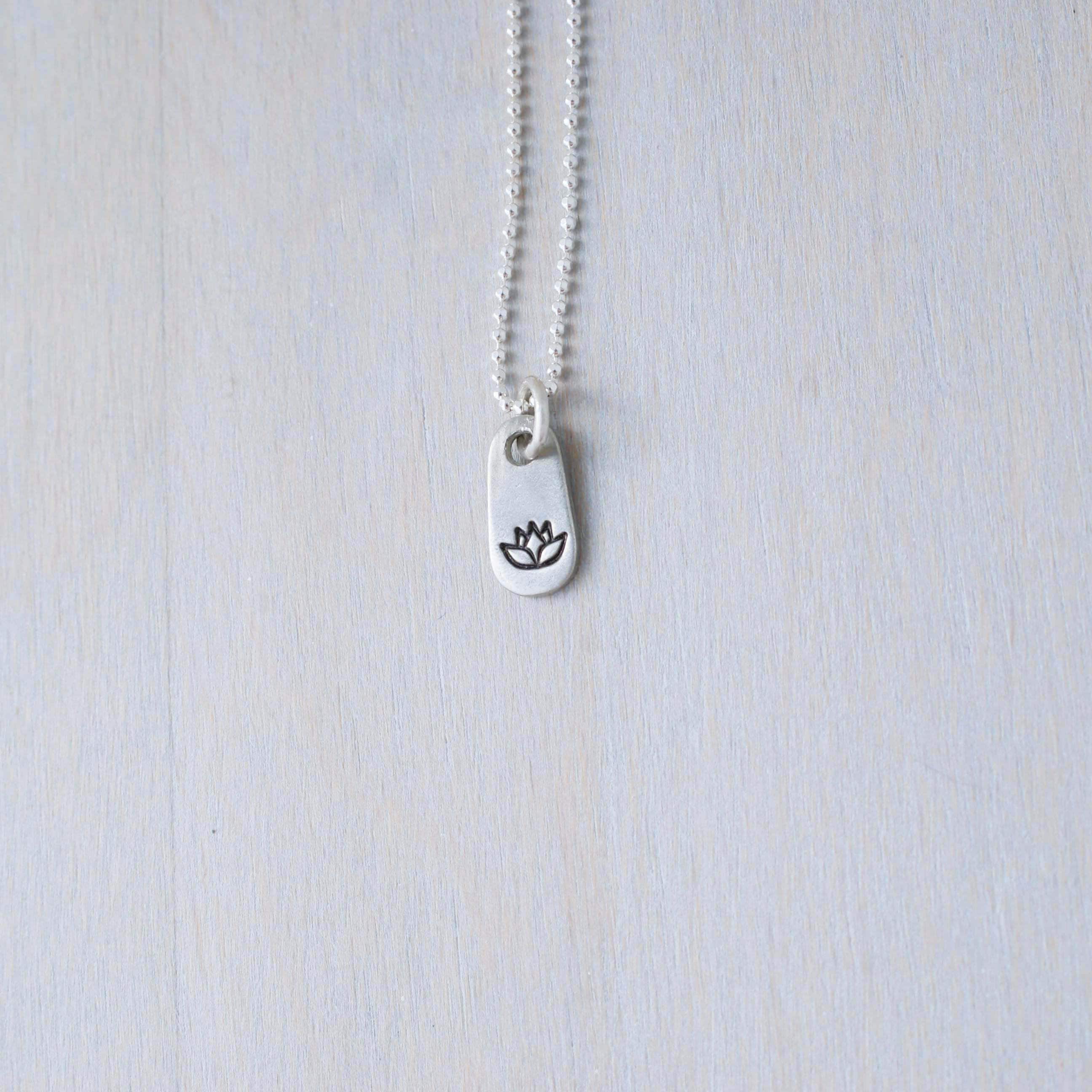 Silver lotus necklace in artisan pewter