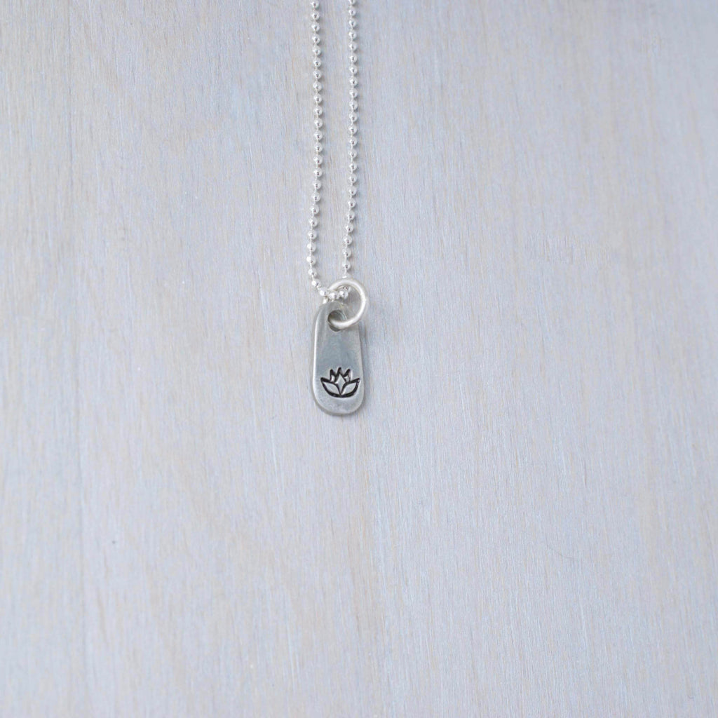 Silver lotus necklace in artisan pewter