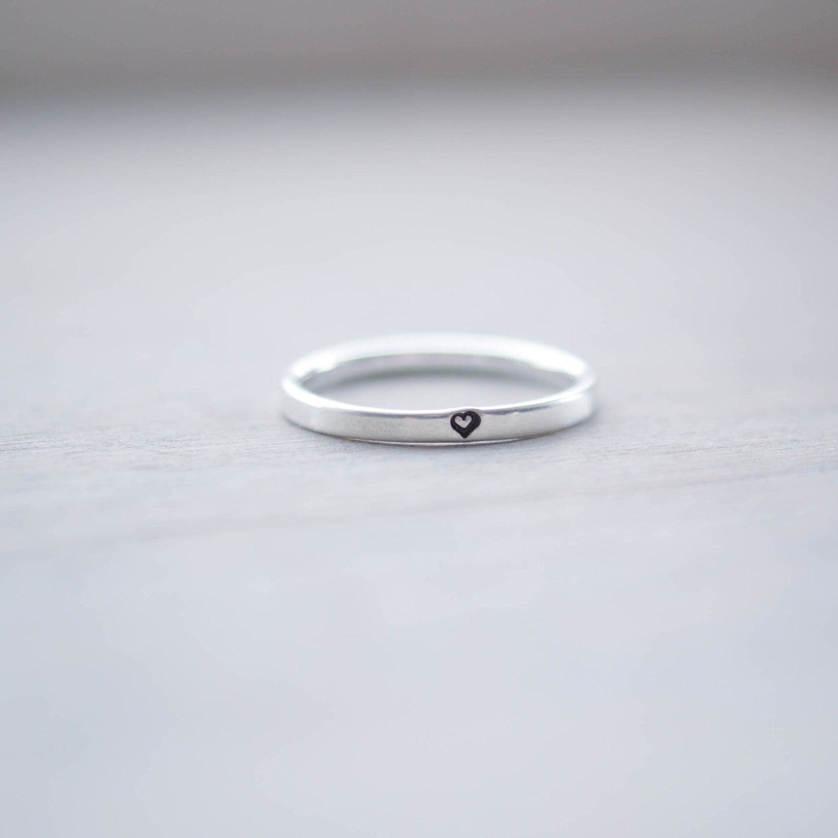 Sterling silver ring stamped with small heart
