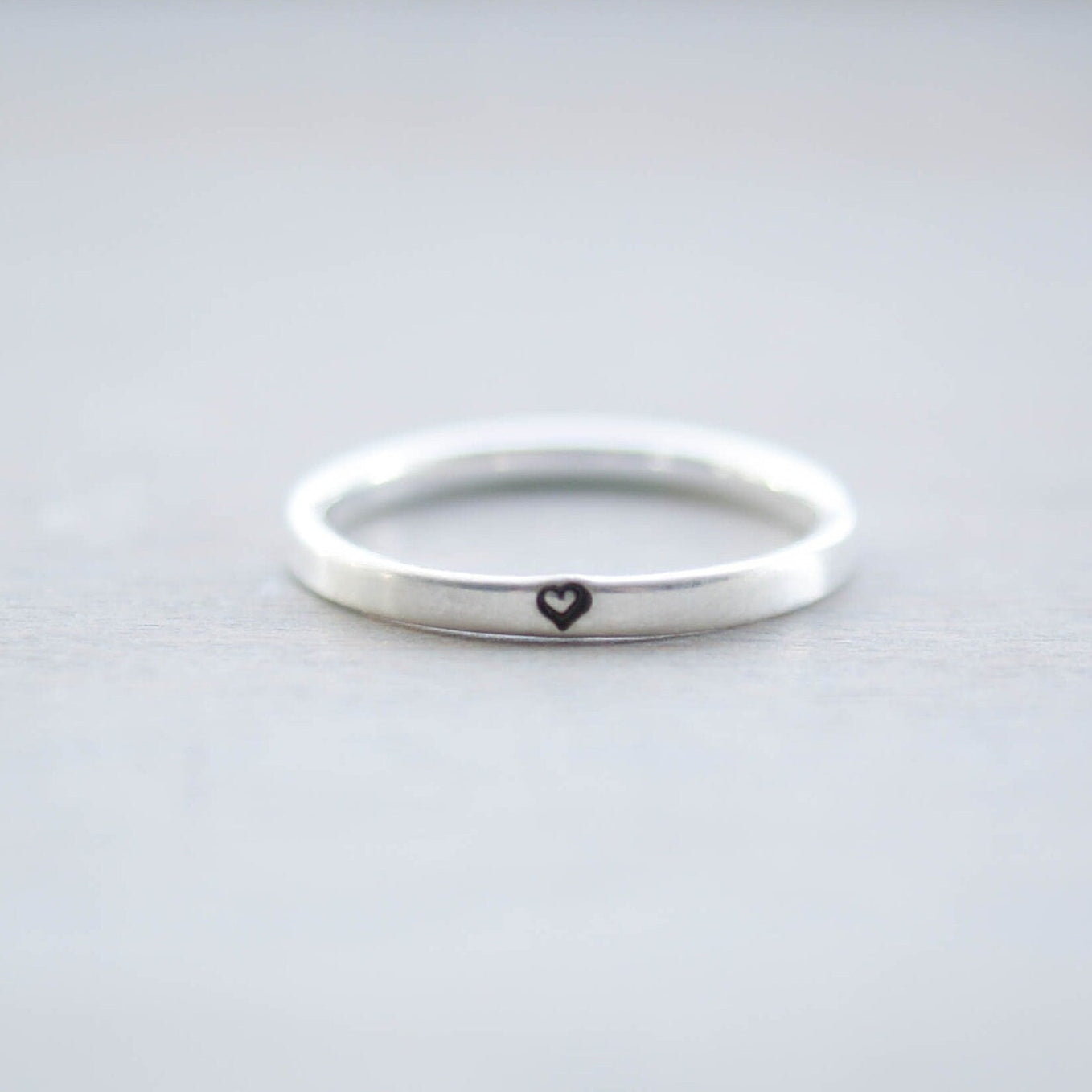 Sterling silver ring stamped with small heart