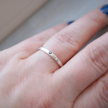 Sterling silver ring stamped with small heart on hand