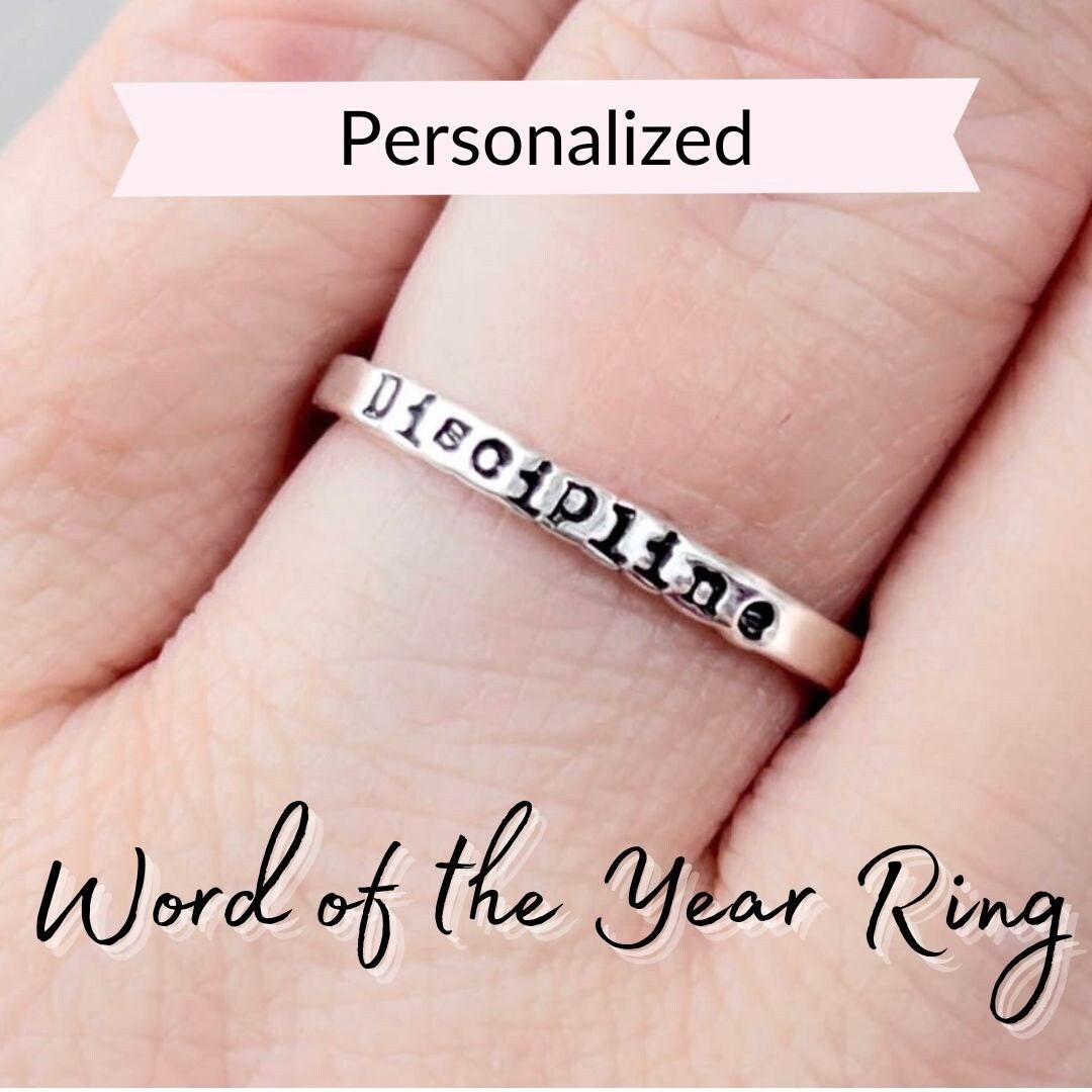Personalized Word of the Year Ring stamped with Discipline on hand
