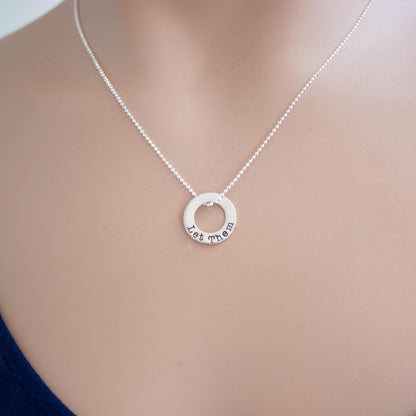 Image of Let Them Daily Affirmation Sterling Silver Necklace being held on neck.