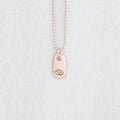 Image of Rose gold small tag necklace stamped with lotus flower