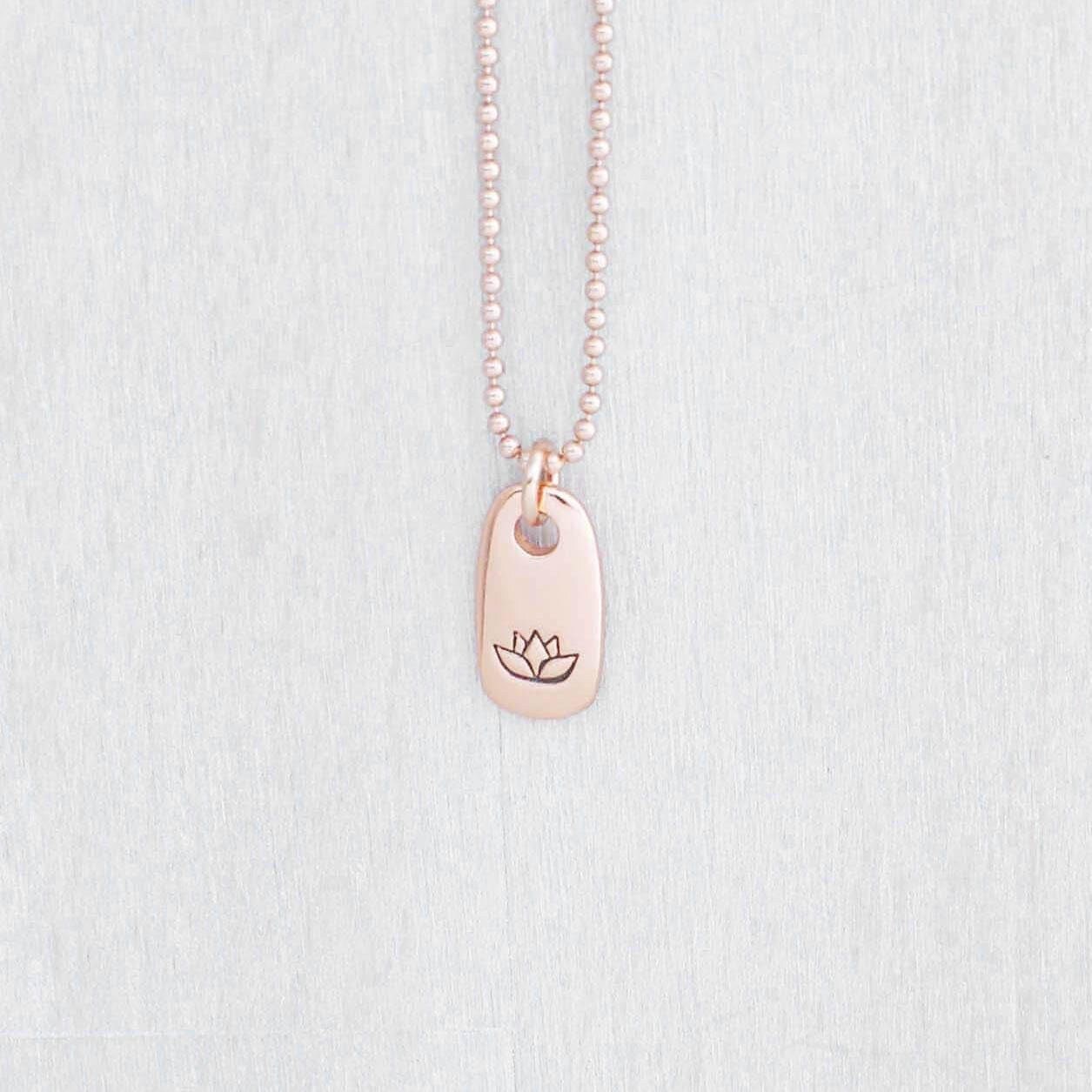 Image of Rose gold small tag necklace stamped with lotus flower