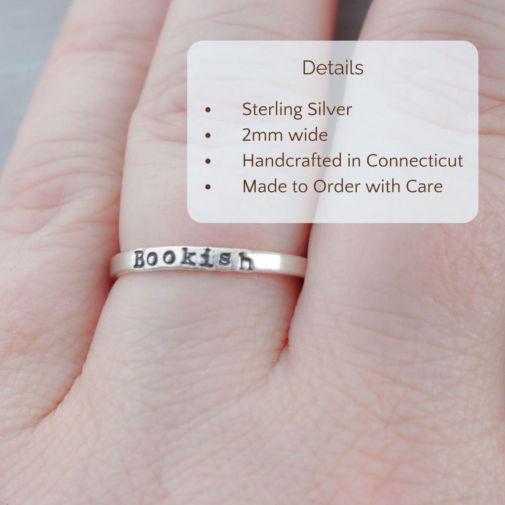 Image of Bookish ring on a hand with the product details overlayed. Sterling silver, 2mm wide, handcrafted in connecticut, made to order with care.