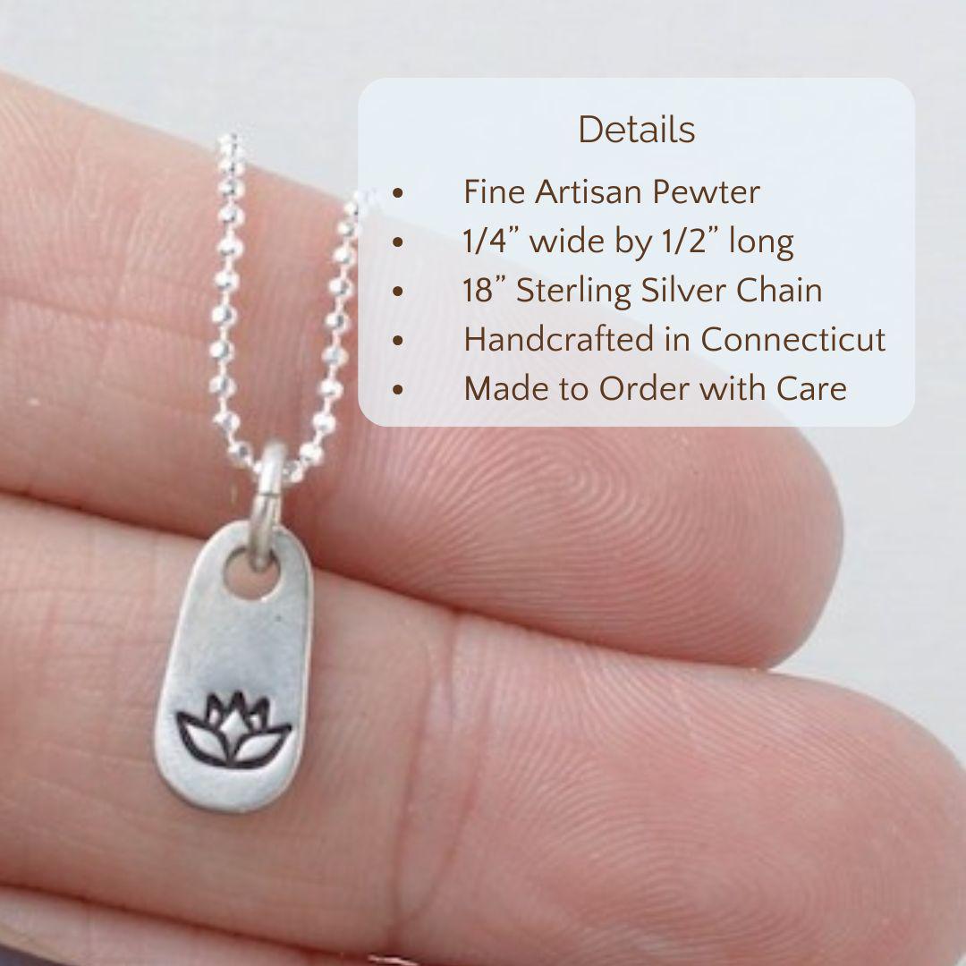 image of silver lotus flower necklace held in hand. product detials are overlayed. Fine Artisan Pewter, 1/4” wide by 1/2” long, 18” Sterling Silver Chain.