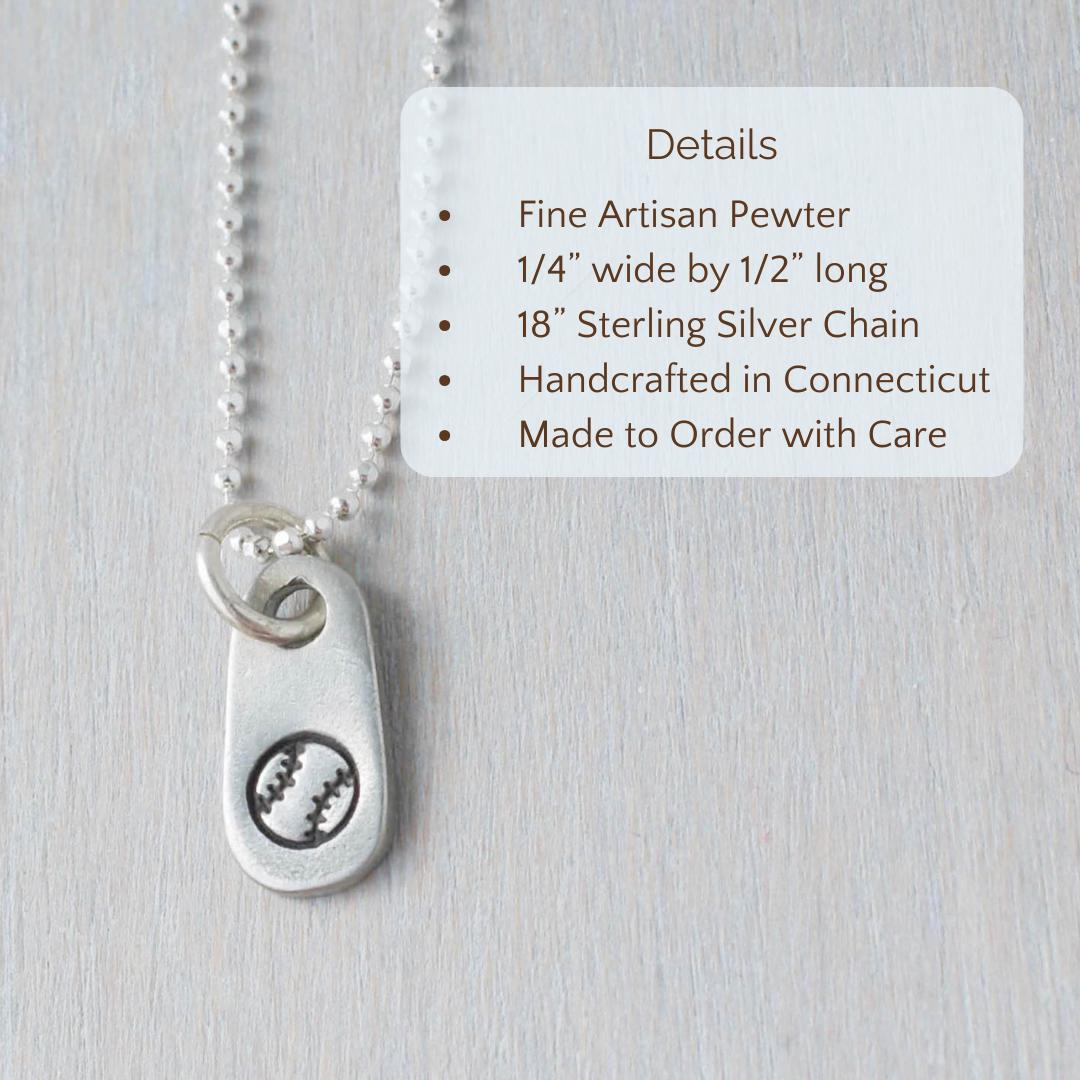 image of silver softball necklace being held in hand with text overlay that says
Product Details, Fine Artisan Pewter , 1/4” wide by 1/2” long, 18” Sterling Silver Chain, Handcrafted in Connecticut, Made to Order with Care