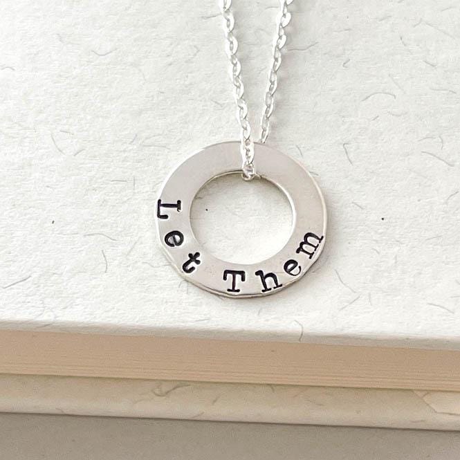Sterling Silver Necklace stamped with Let Them on book