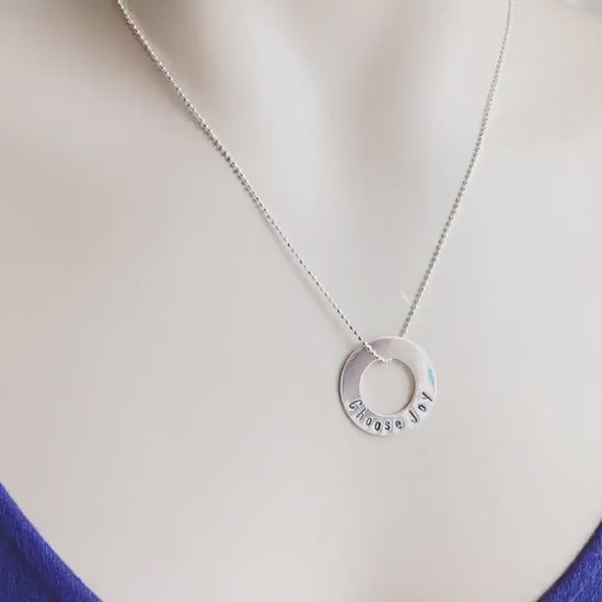 Choose Joy Necklace in sterling silver on neck and being held