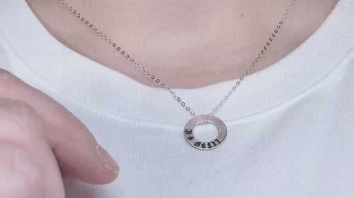 video of Be Still sterling silver necklace being pushed and pulled along the chain
