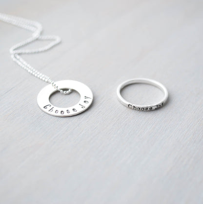 Choose Joy Circle Necklace in Sterling Silver next to Choose Joy Sterling Silver Ring
