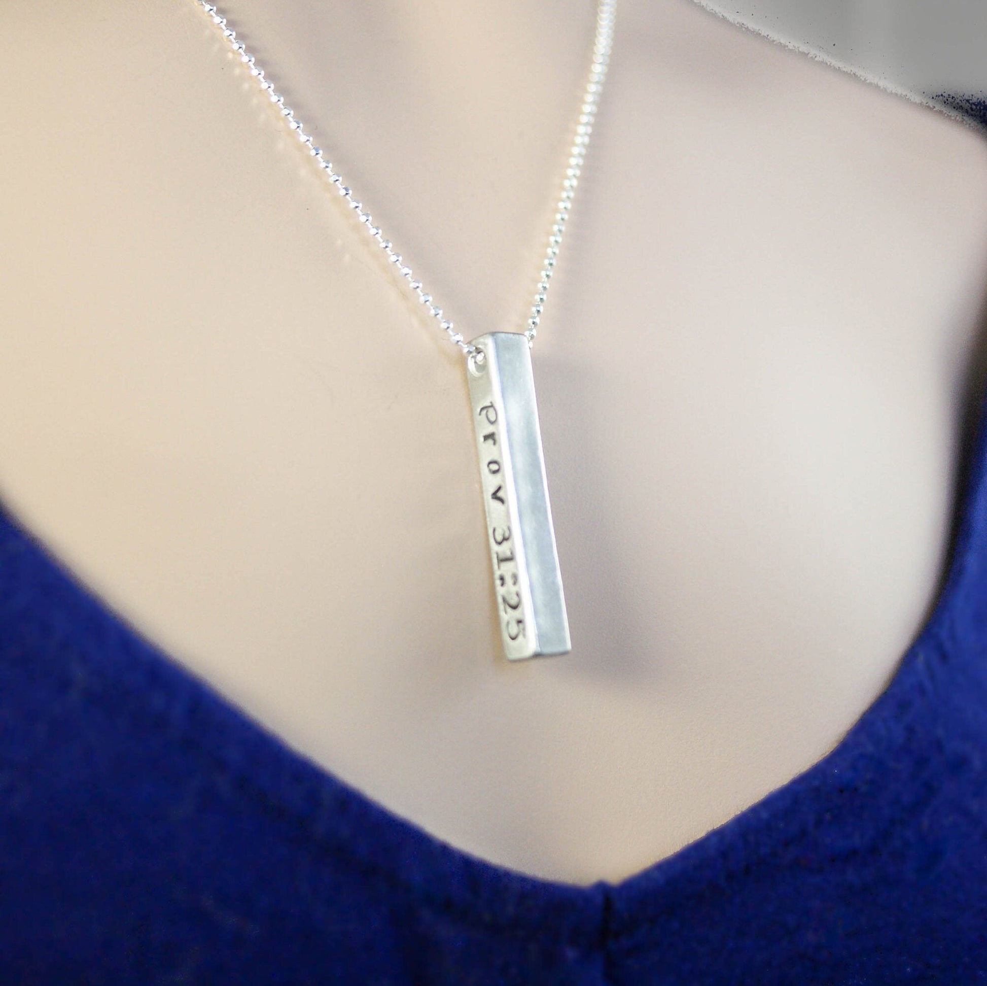 Long silver bar necklace in Artisan Pewter handstamped with Prov 31:25 on neck