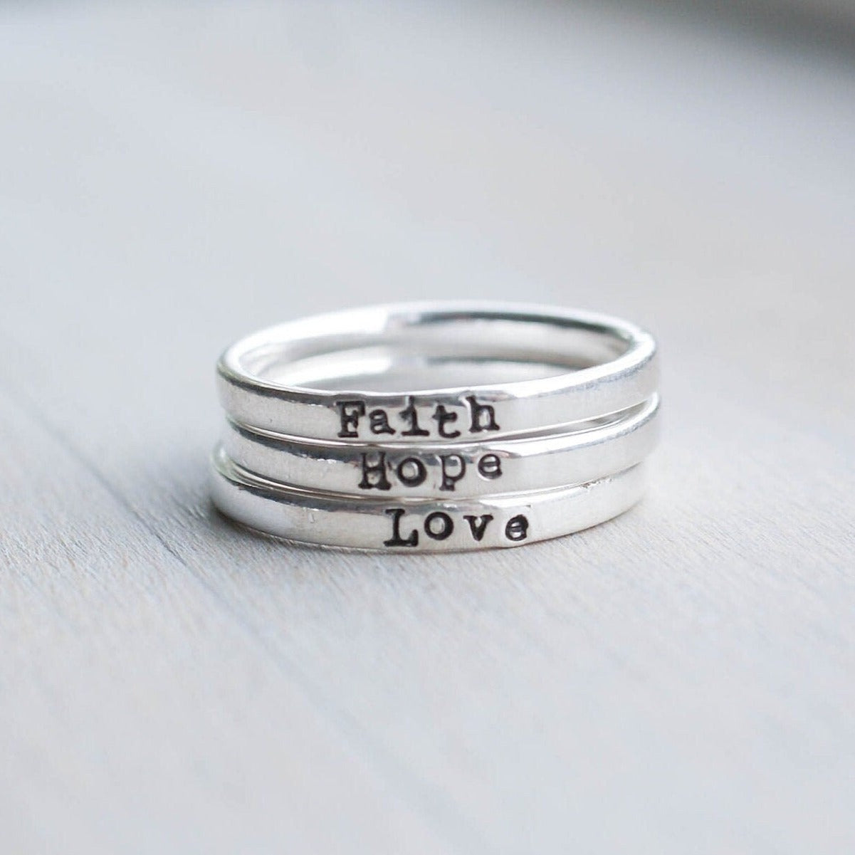 3 Sterling silver rings stamped with Faith, hope and love