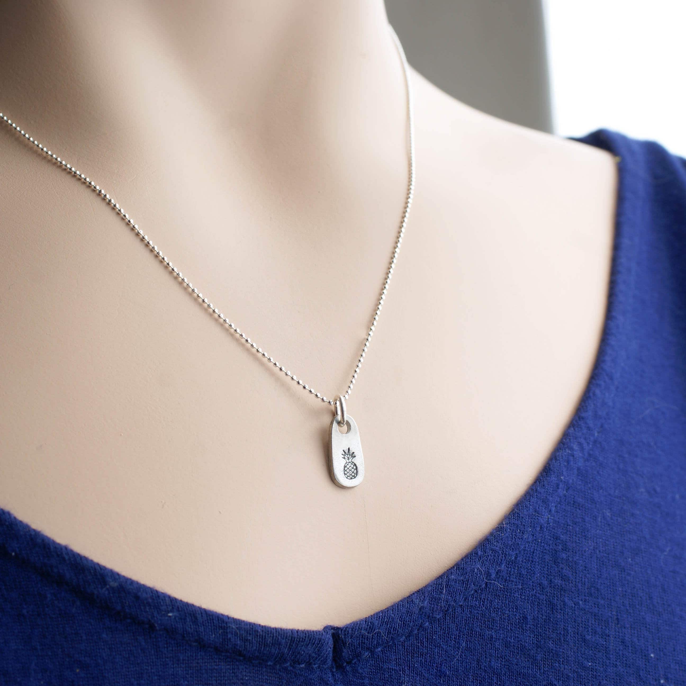 Dainty silver Pineapple necklace in artisan pewter on neck
